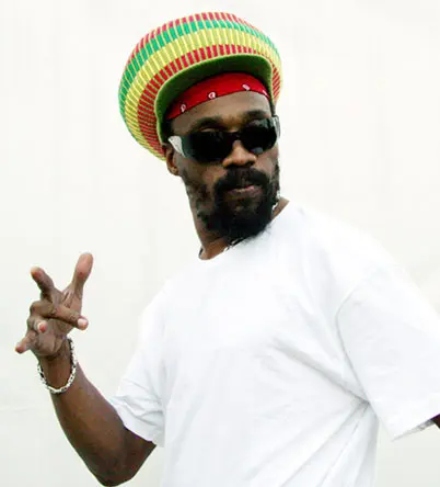 A man with a hat and sunglasses on.